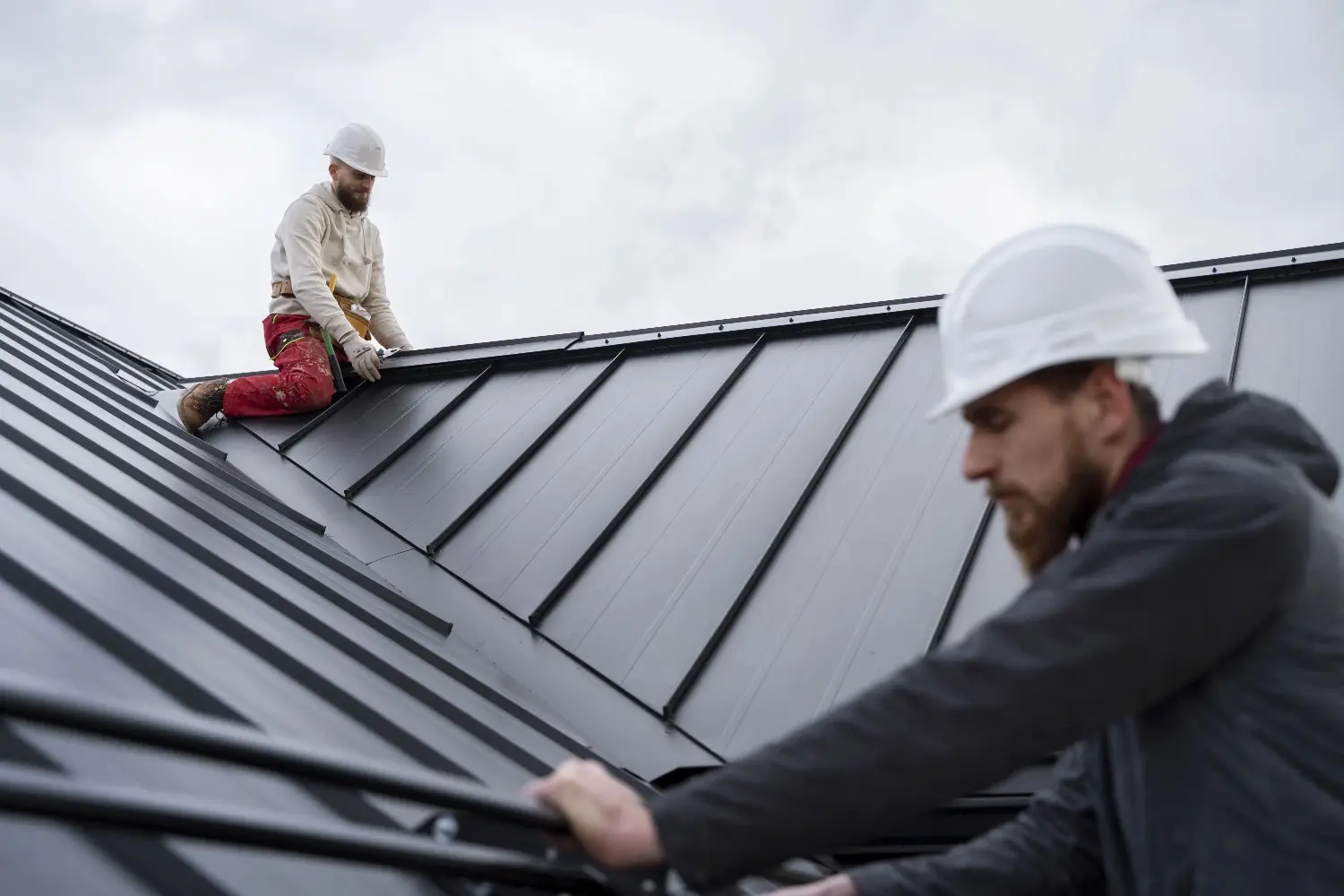 working on top of the roof long island roofing contractor