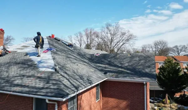 Roof flashing repair Long Island home showing damaged roof edges and shingles
