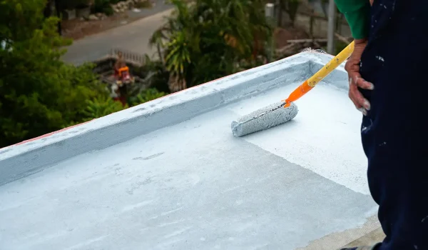 Commercial flat roof maintenance Long Island - TPO membrane inspection on a Nassau County warehouse