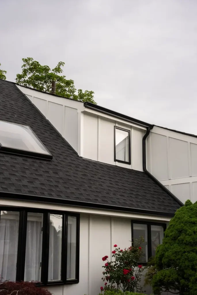 Inspecting roof leak mold and moisture damage on a Long Island home exterior
